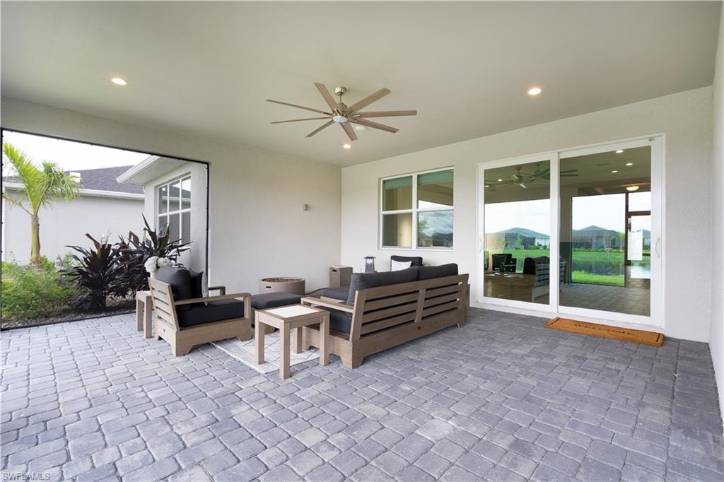View of patio / terrace with an outdoor hangout area and a ceiling fan