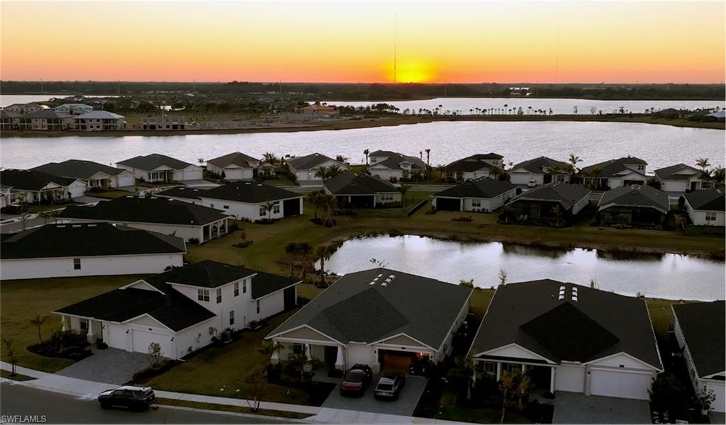 Aerial perspective of suburban area with a nearby body of water
