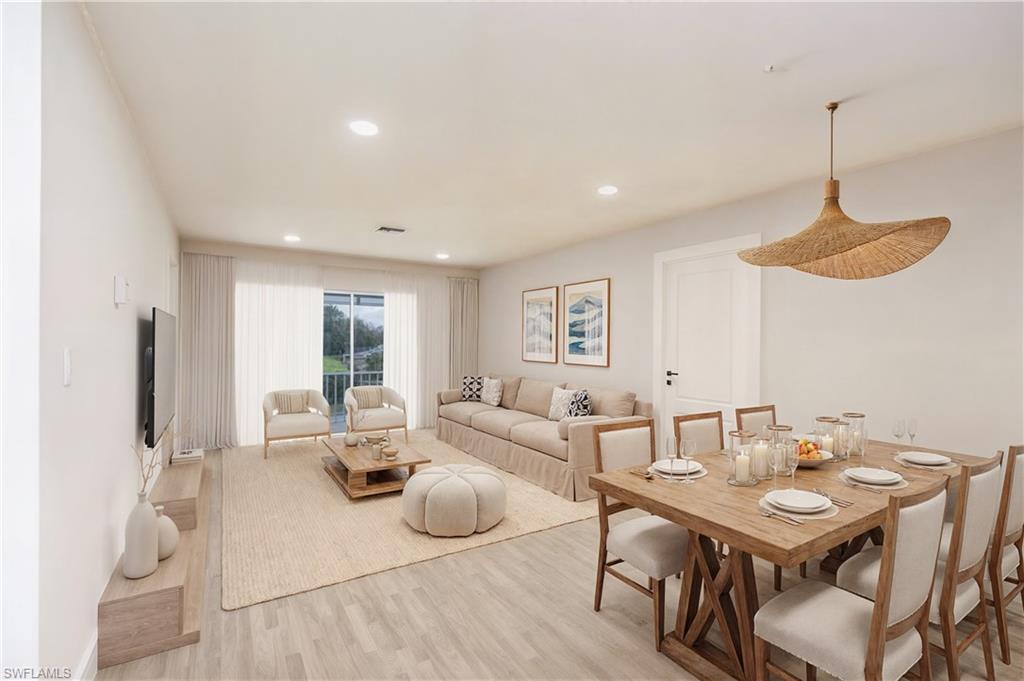 Dining space with recessed lighting and light wood-style flooring