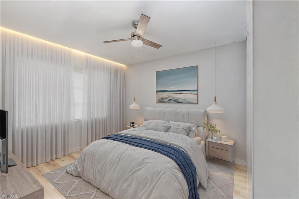 Bedroom with wood finished floors and ceiling fan