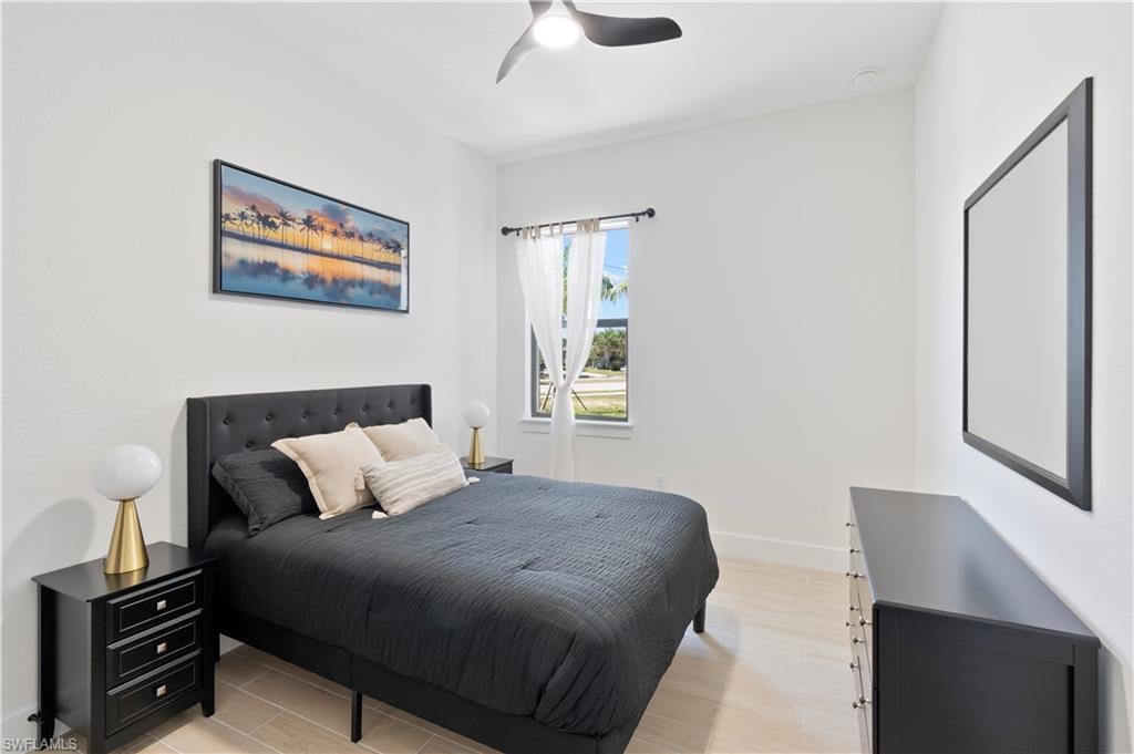 Bedroom featuring light wood-type flooring and a ceiling fan