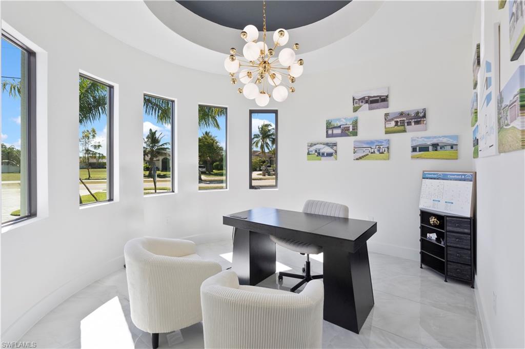 Office with a chandelier and baseboards