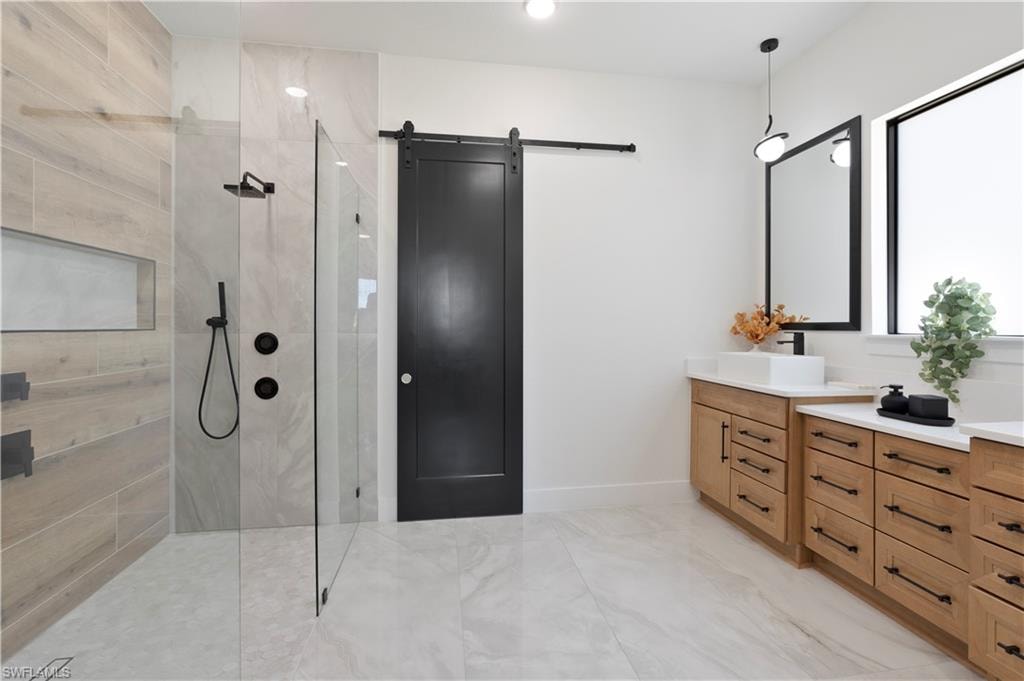 Full bathroom featuring a walk in shower and double vanity