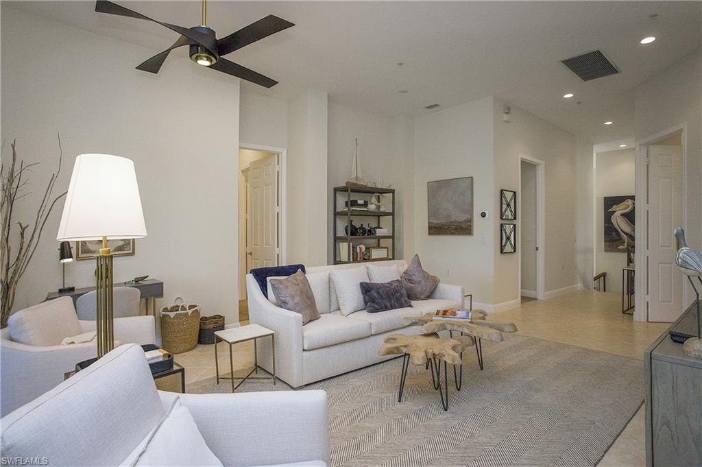 Living room featuring ceiling fan