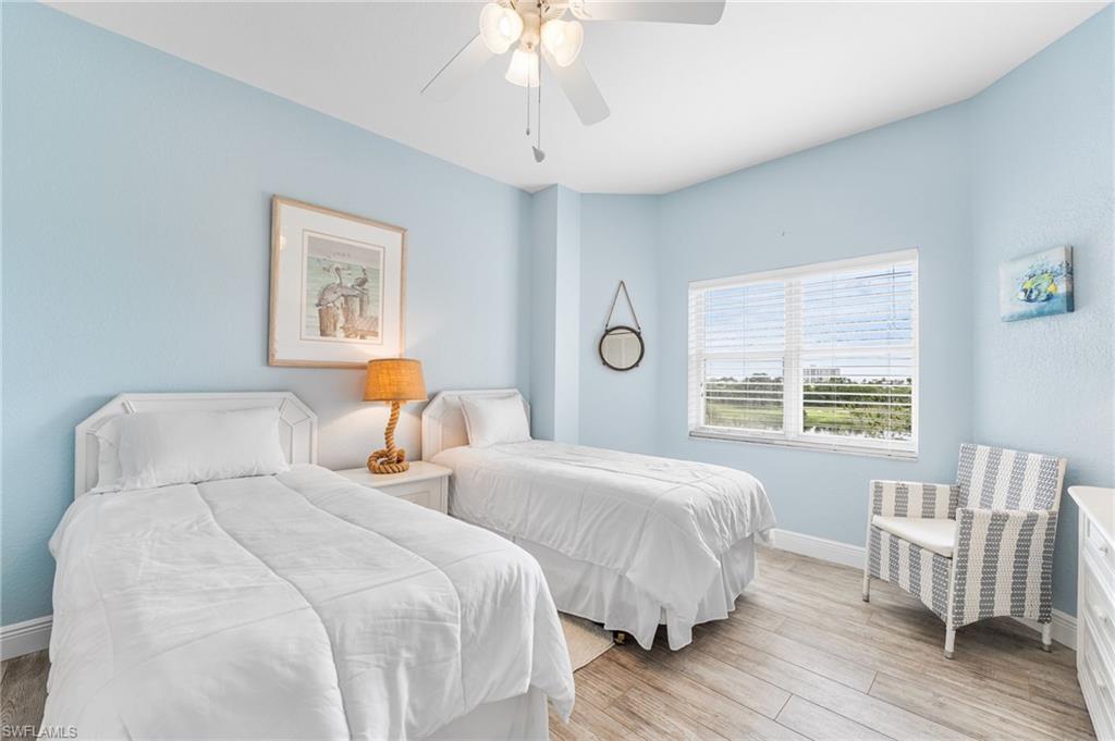 Bedroom featuring wood finished floors and a ceiling fan