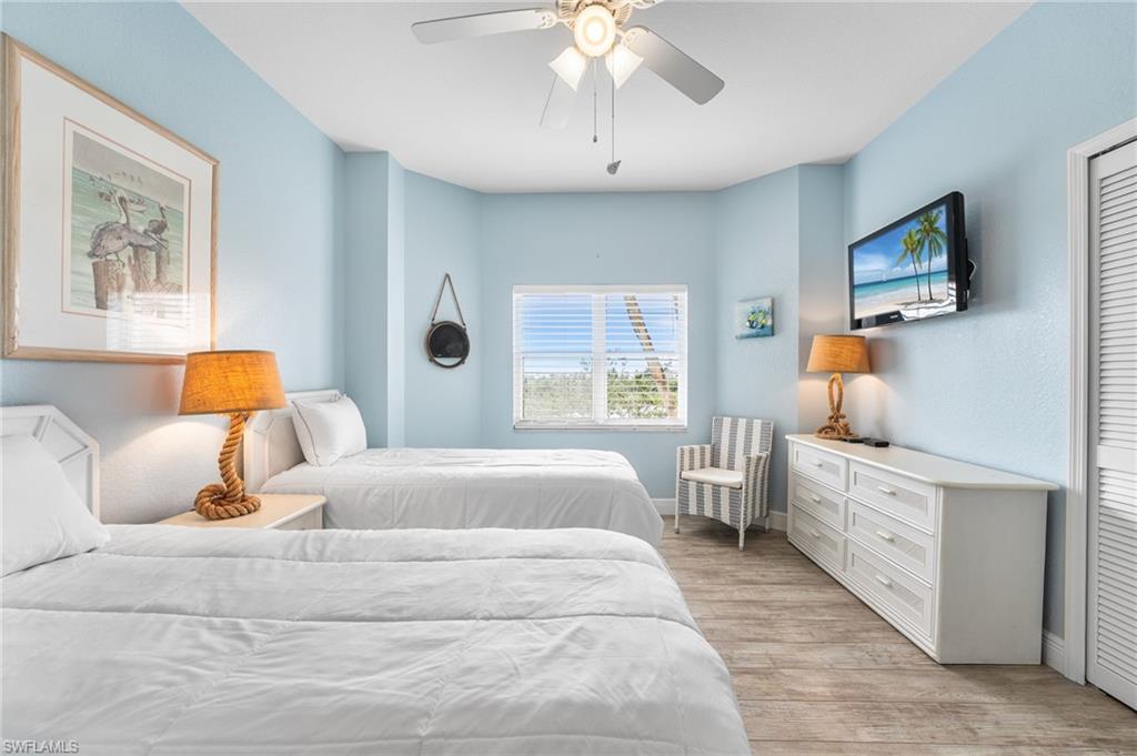 Bedroom featuring light wood-type flooring and ceiling fan