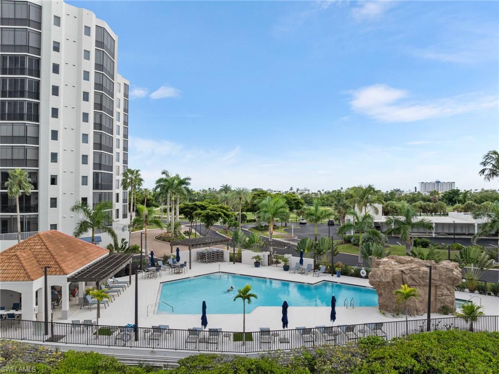 Community pool featuring a patio