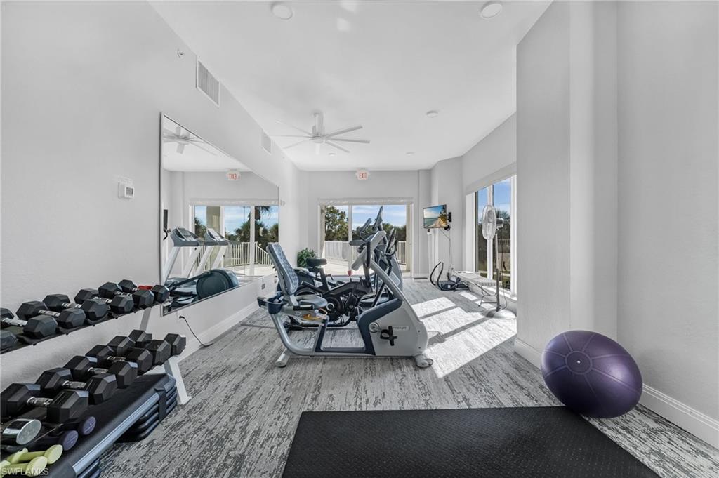 Community Workout room featuring ceiling fan