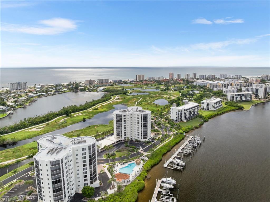 View of urban area featuring a large body of water and a pool