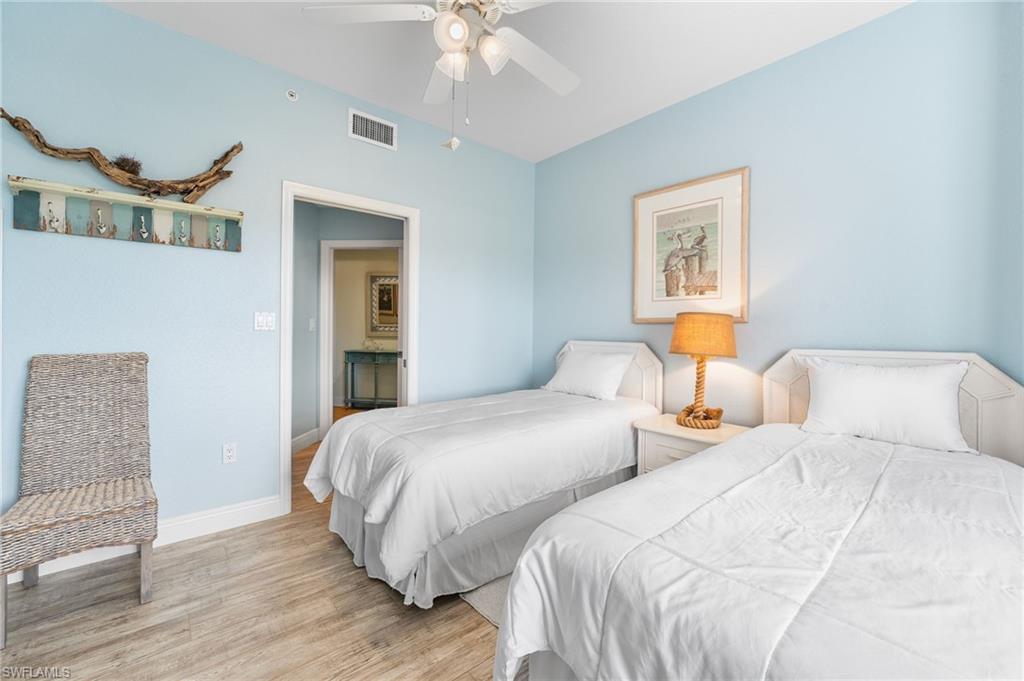 Bedroom with wood finished floors and ceiling fan