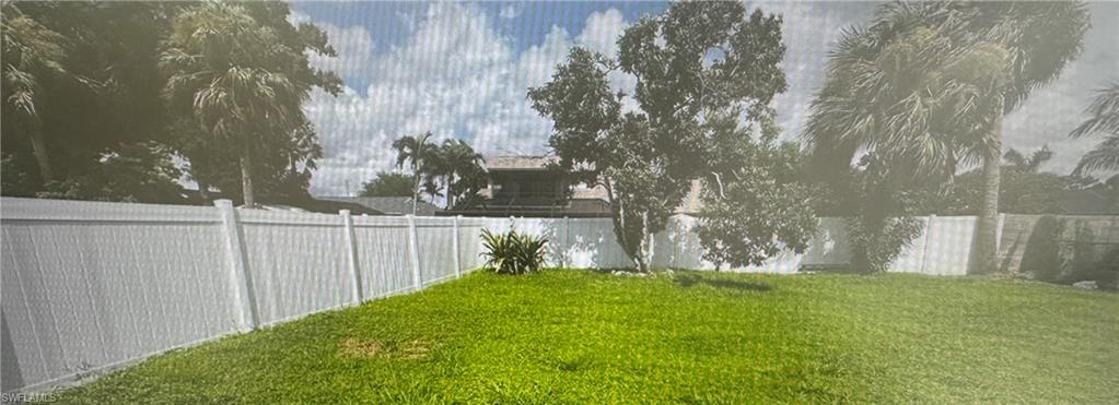 View of fenced backyard