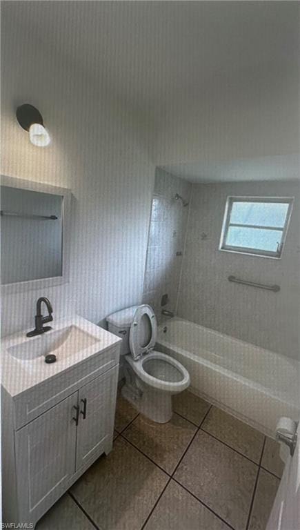 Full bath featuring shower / bath combination, vanity, and light tile patterned floors