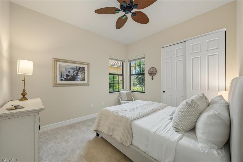 Bedroom with carpet floors, a ceiling fan, and a closet