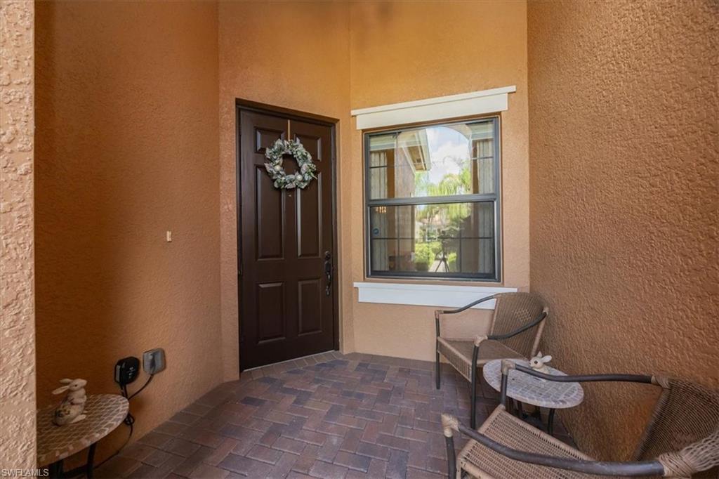 Property entrance with stucco siding