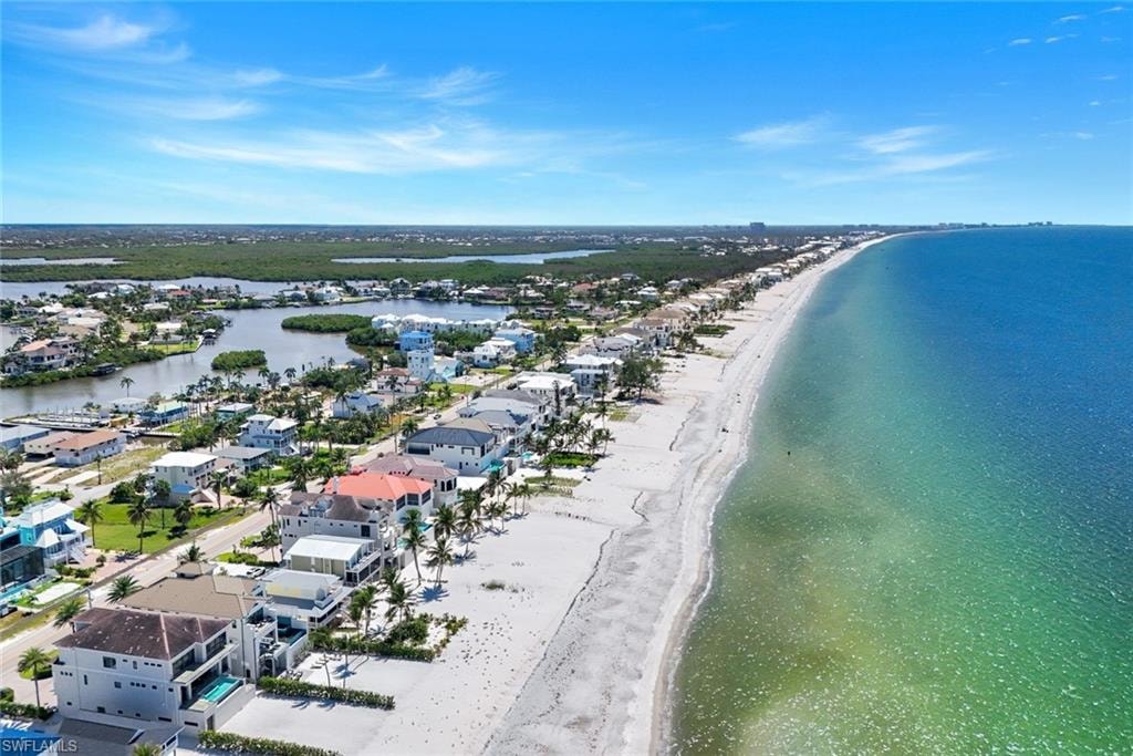 Aerial perspective of suburban area featuring extended coastline