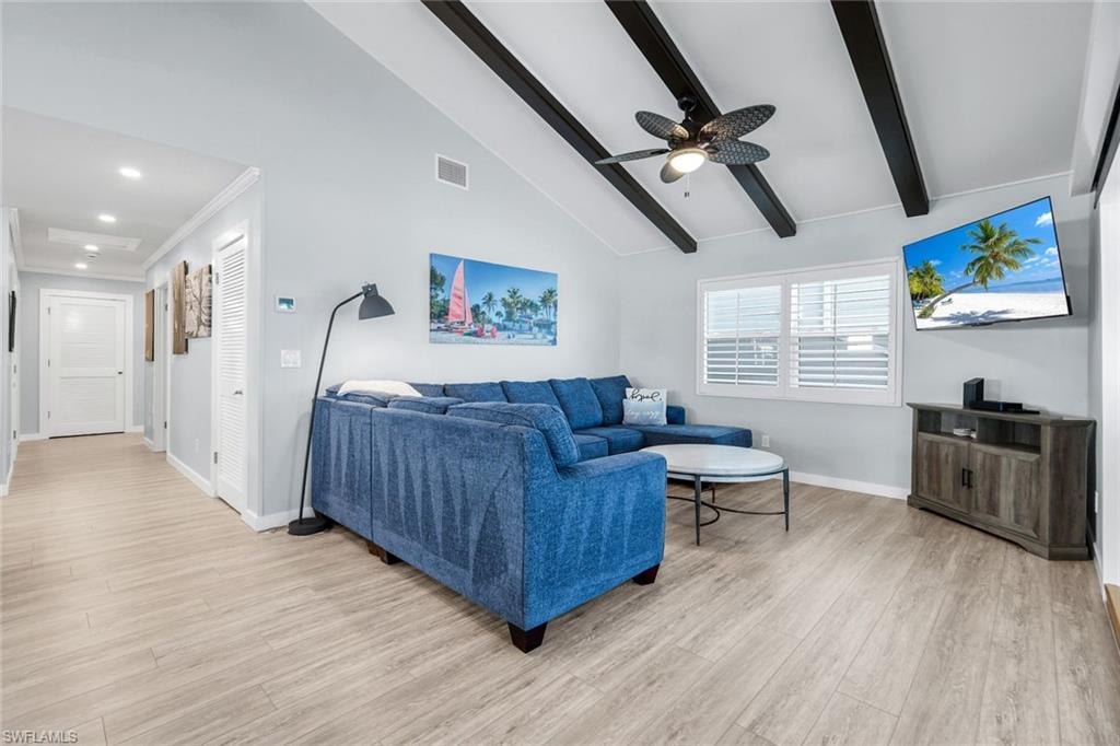 Living area with light wood finished floors and a ceiling fan