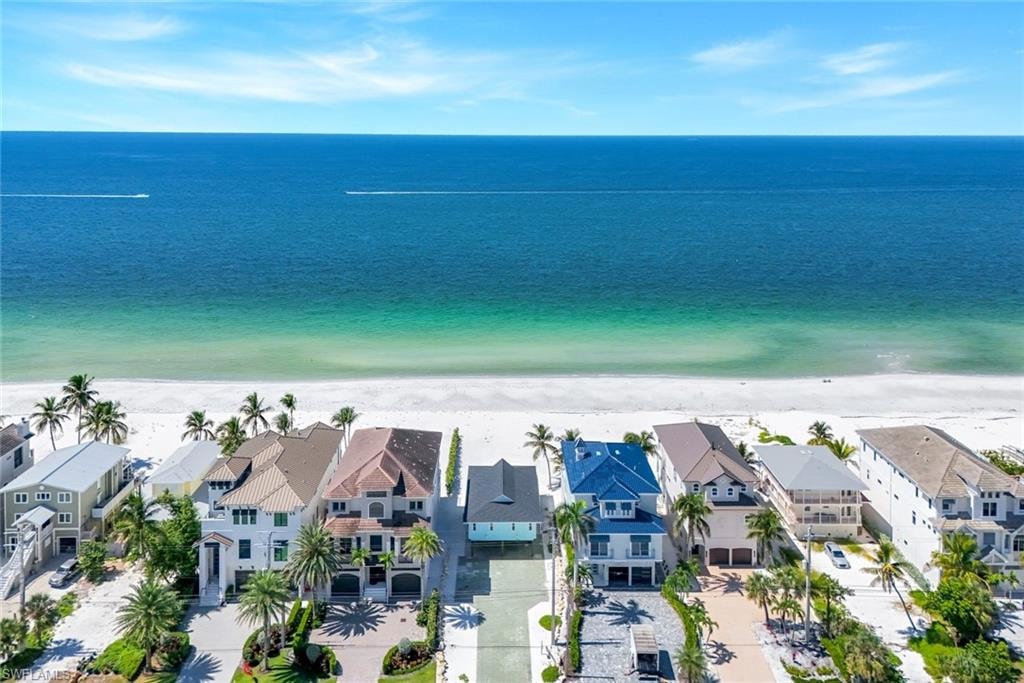 Aerial view of residential area with expansive coastline