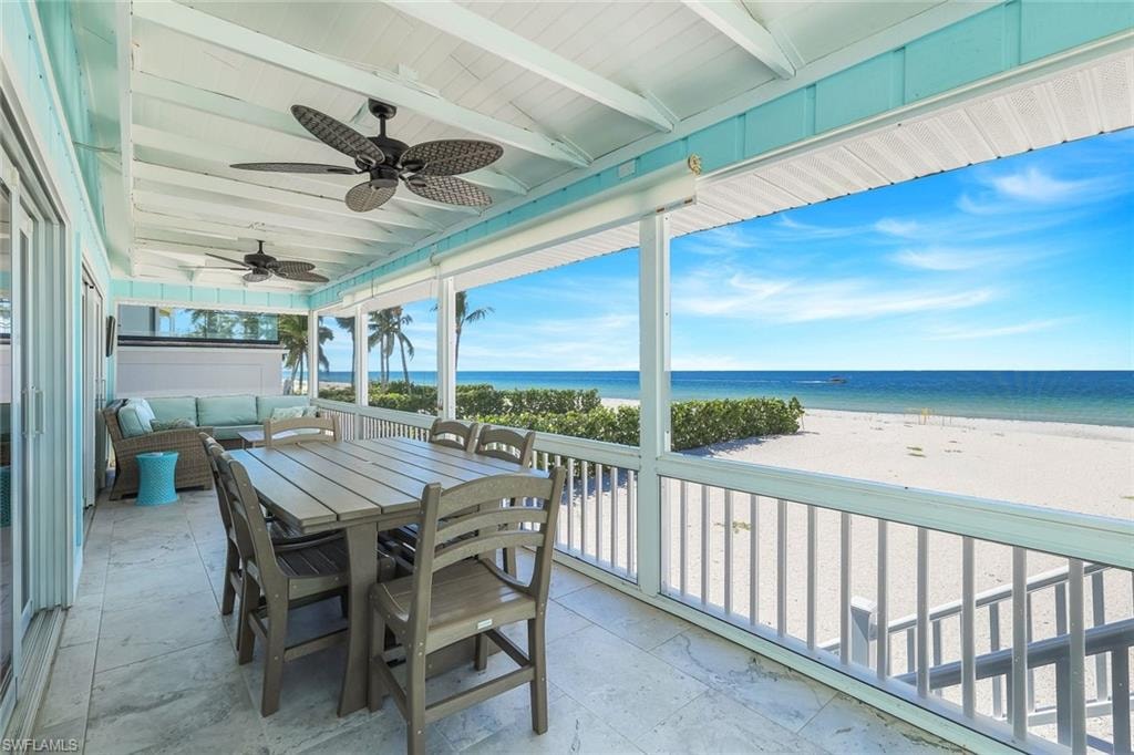 Sunroom / solarium featuring view of water and beach, beamed ceiling, an outdoor hangout area, ceiling fan, and outdoor dining area