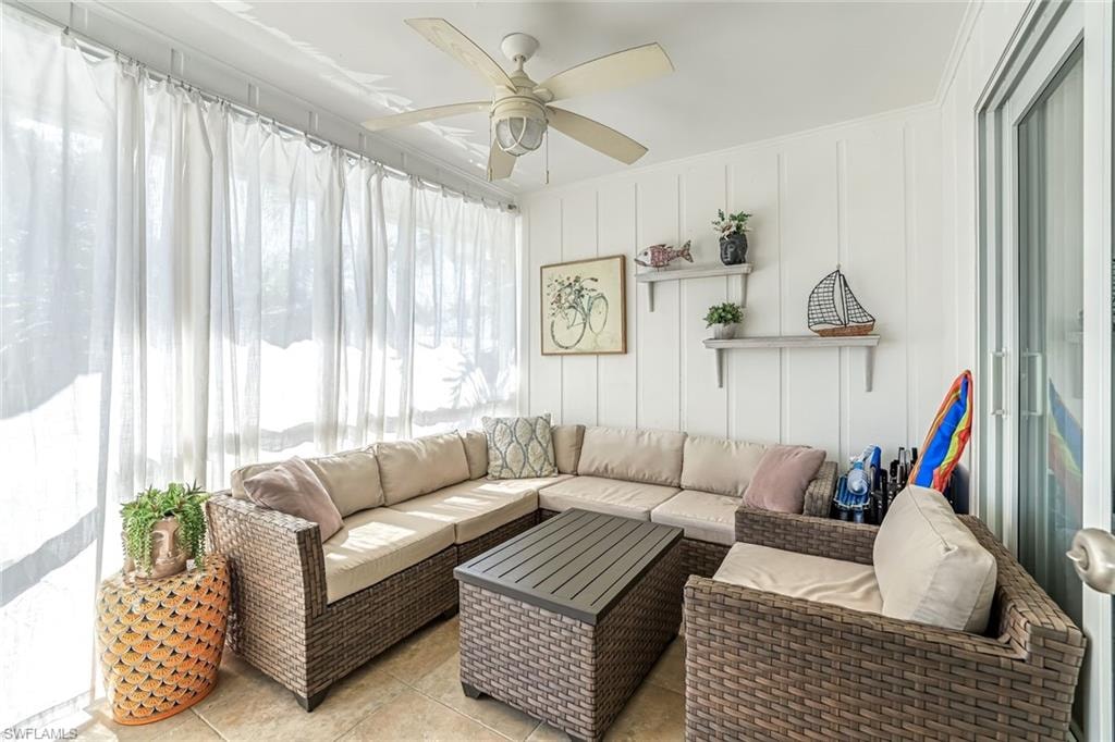 Sunroom with a ceiling fan