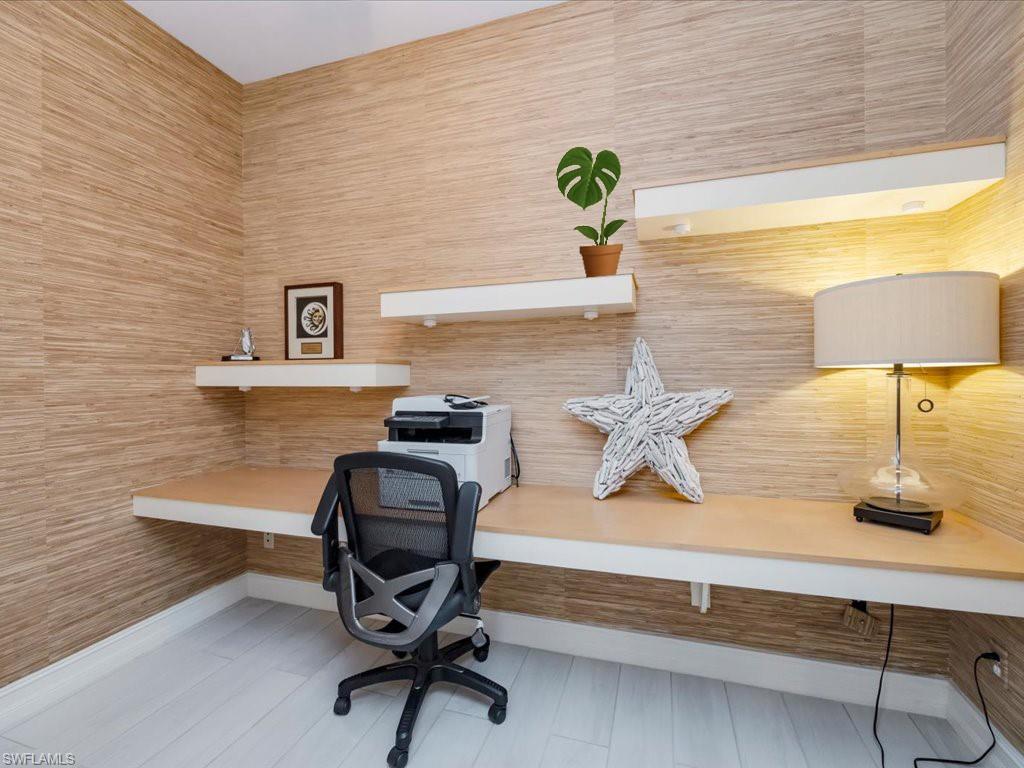 Office area featuring built in study area