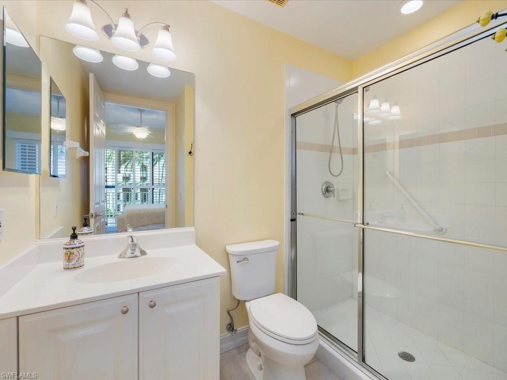 Full bath with connected bathroom, a shower stall, and vanity