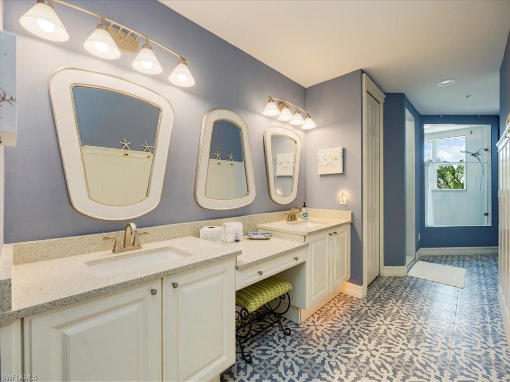 Bathroom with double vanity and recessed lighting