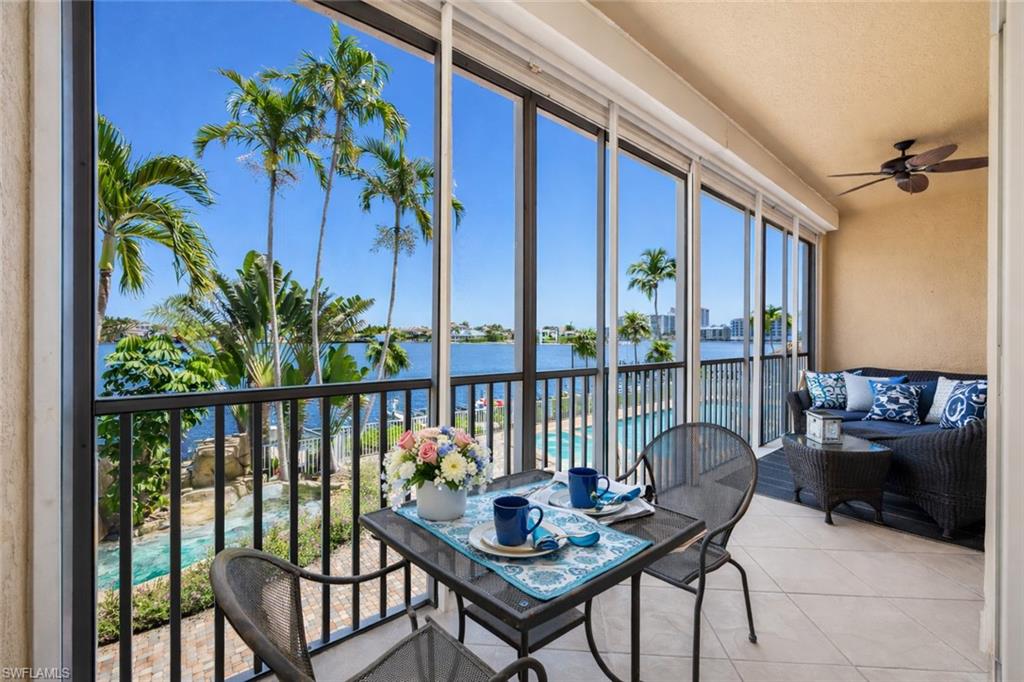 Sunroom with a water view
