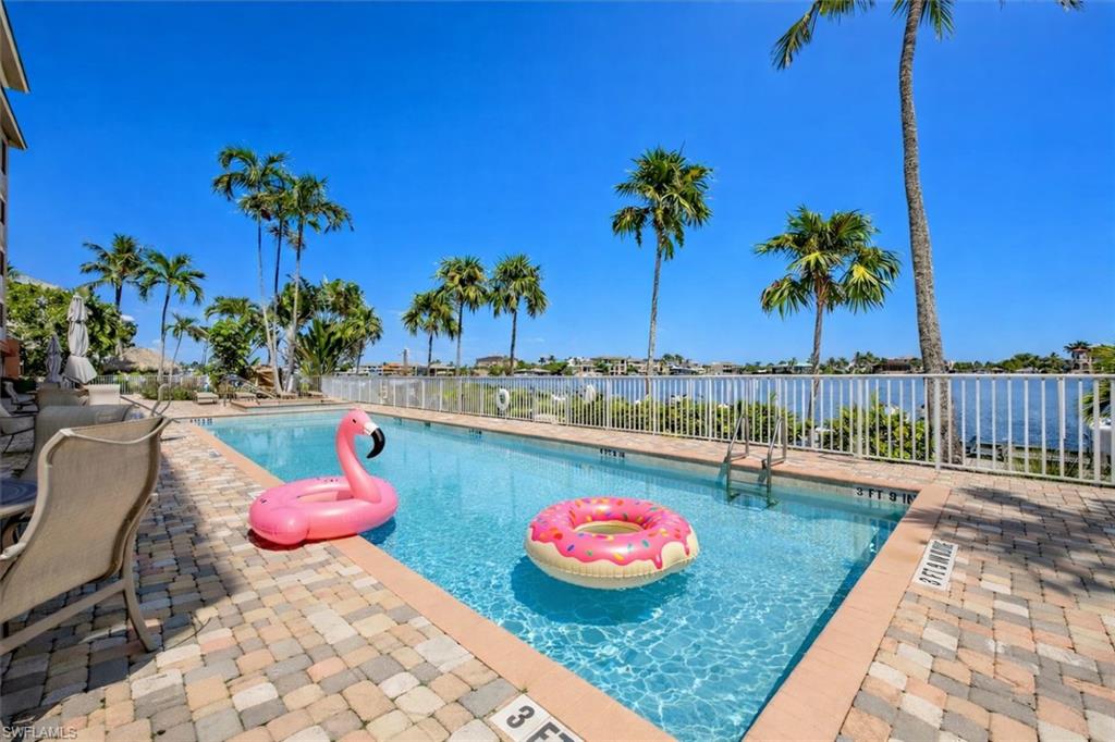 Community pool with a patio