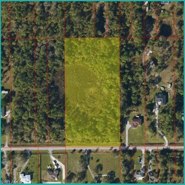 Aerial overview of property's location featuring property parcel outlined