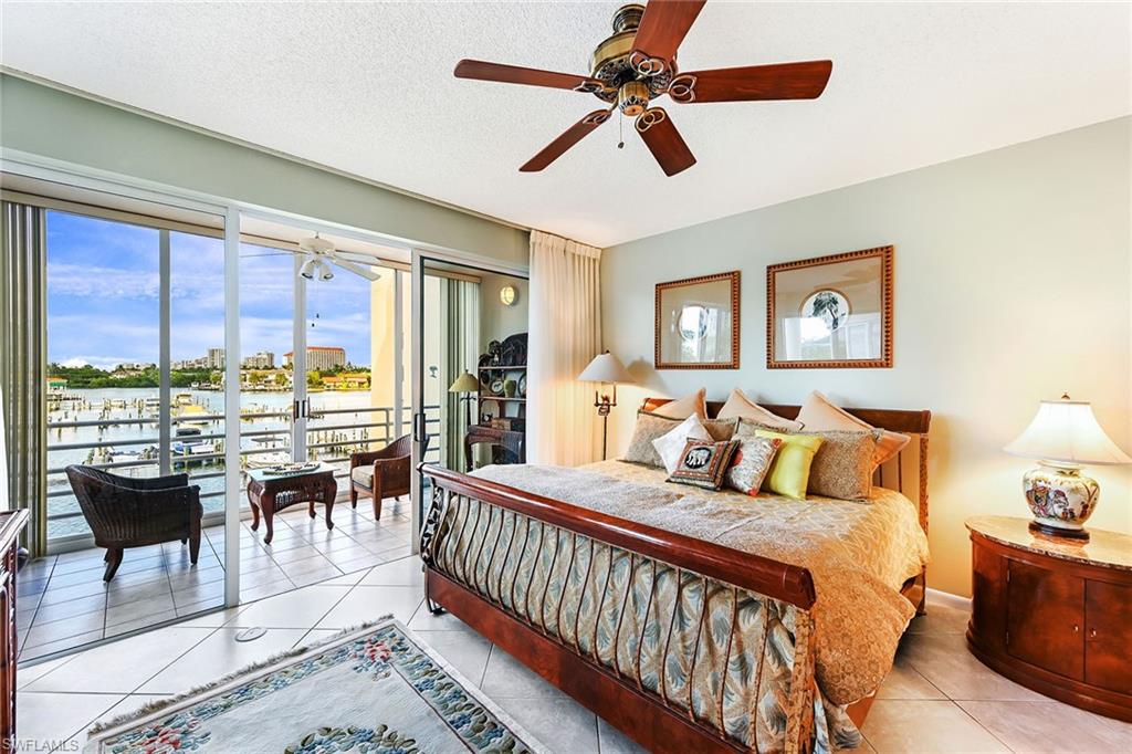 Primary Bedroom with enclosed patio & king bed