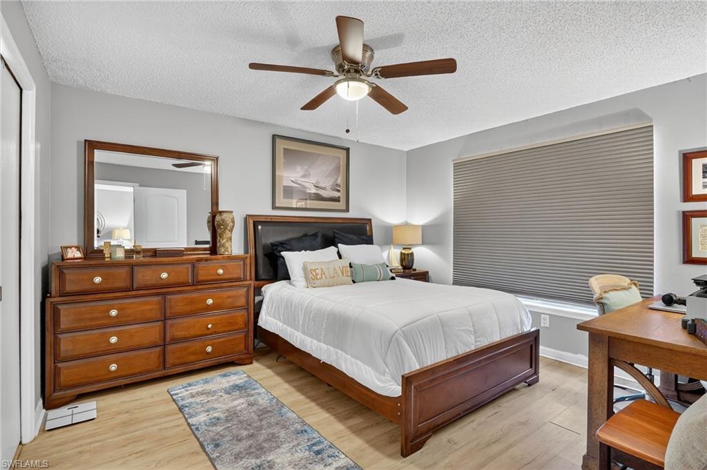 Bedroom with Hunter Douglas room darkening shade down.