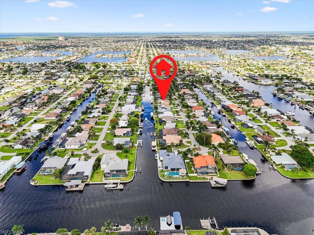 Aerial view of residential area featuring a large body of water
