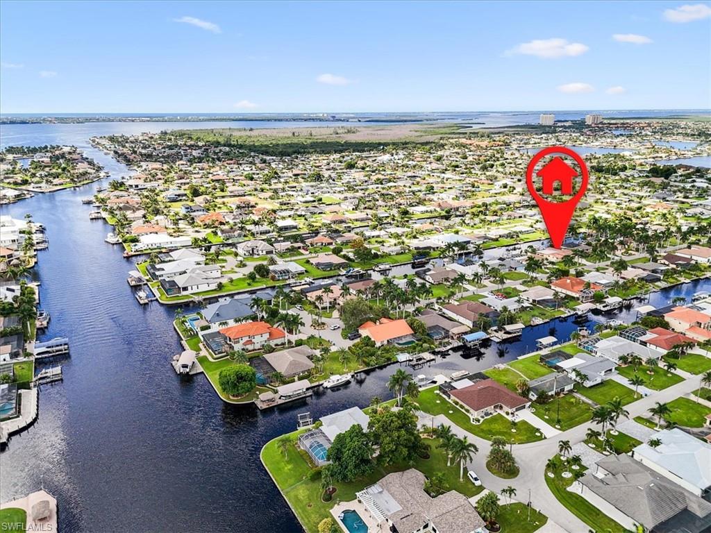 Aerial view of residential area with a nearby body of water