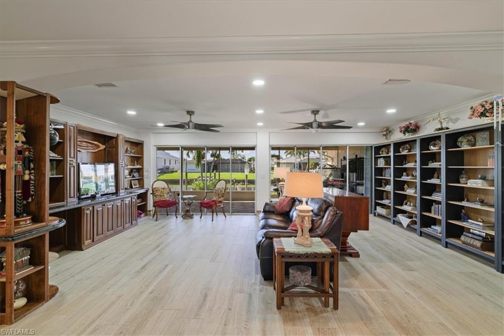 Great room with custom-built cabinets and shelves.