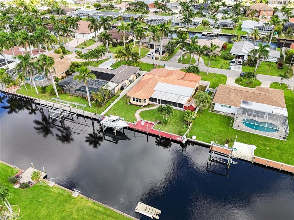 Aerial view of residential area featuring a large body of water