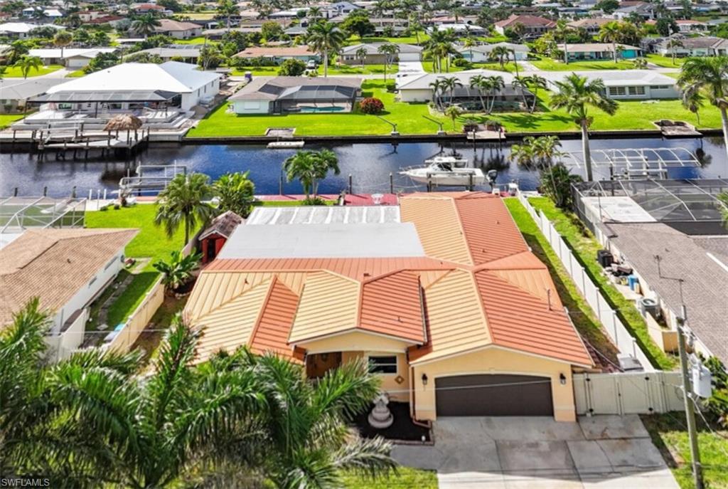 Aerial view of residential area with a large body of waterDirect Gulf Access Waterfront home, minutes to open water!