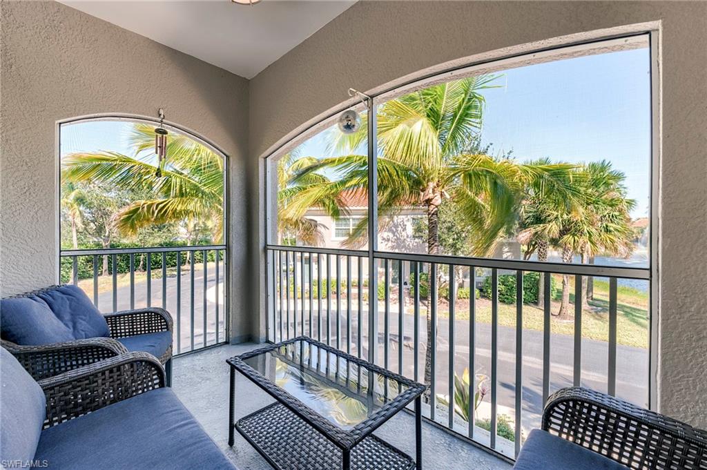 Balcony featuring a sunroom