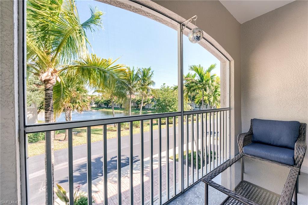 Balcony with a water view and a sunroom