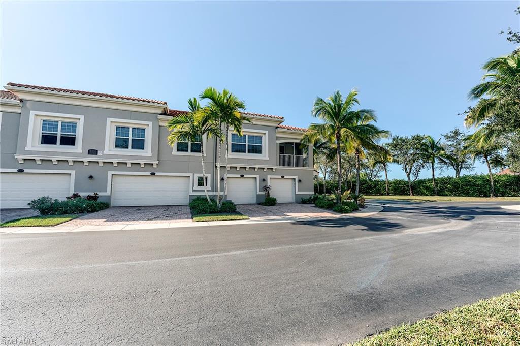 Mediterranean / spanish-style home with stucco siding, a tile roof, driveway, and an attached garage