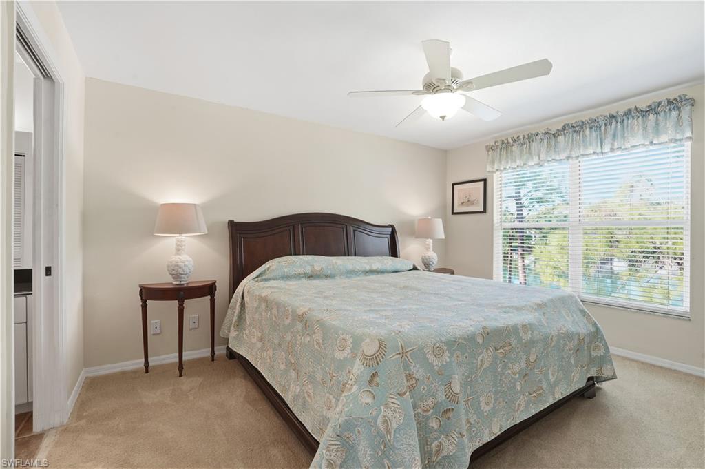 Bedroom featuring light colored carpet and ceiling fan