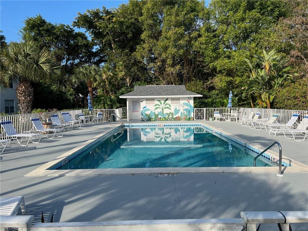Community pool with a patio area