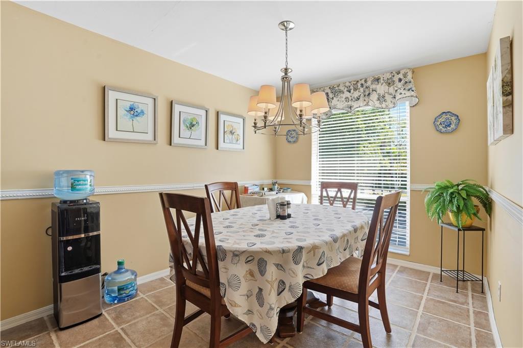 Dining space with a chandelier and light tile patterned floors
