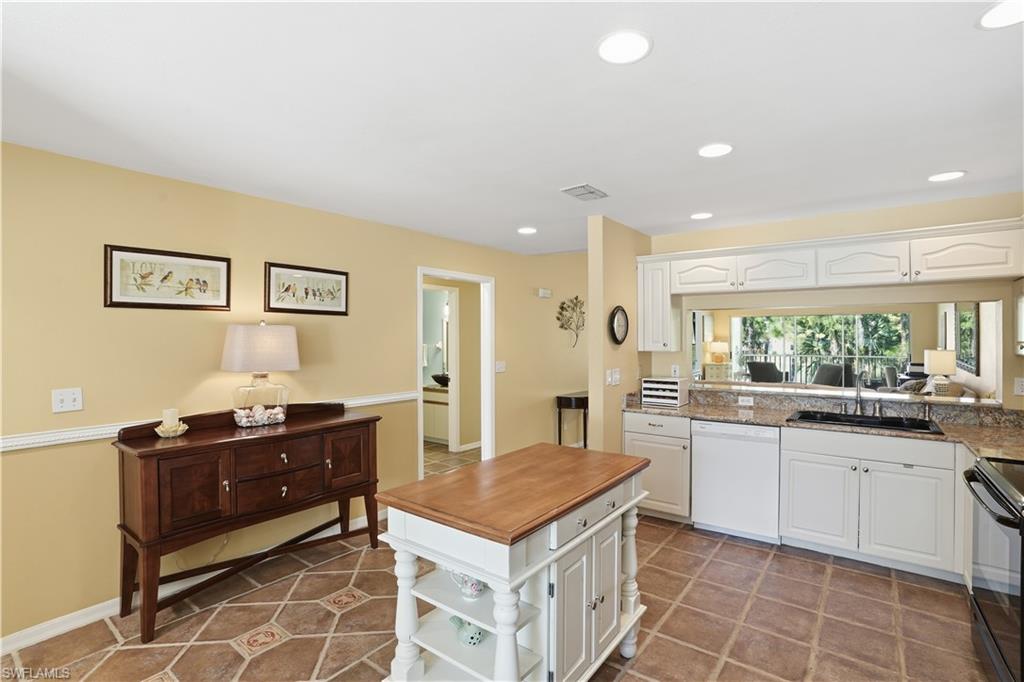 Kitchen featuring white cabinets, dishwasher, black range with electric stovetop, and recessed lighting