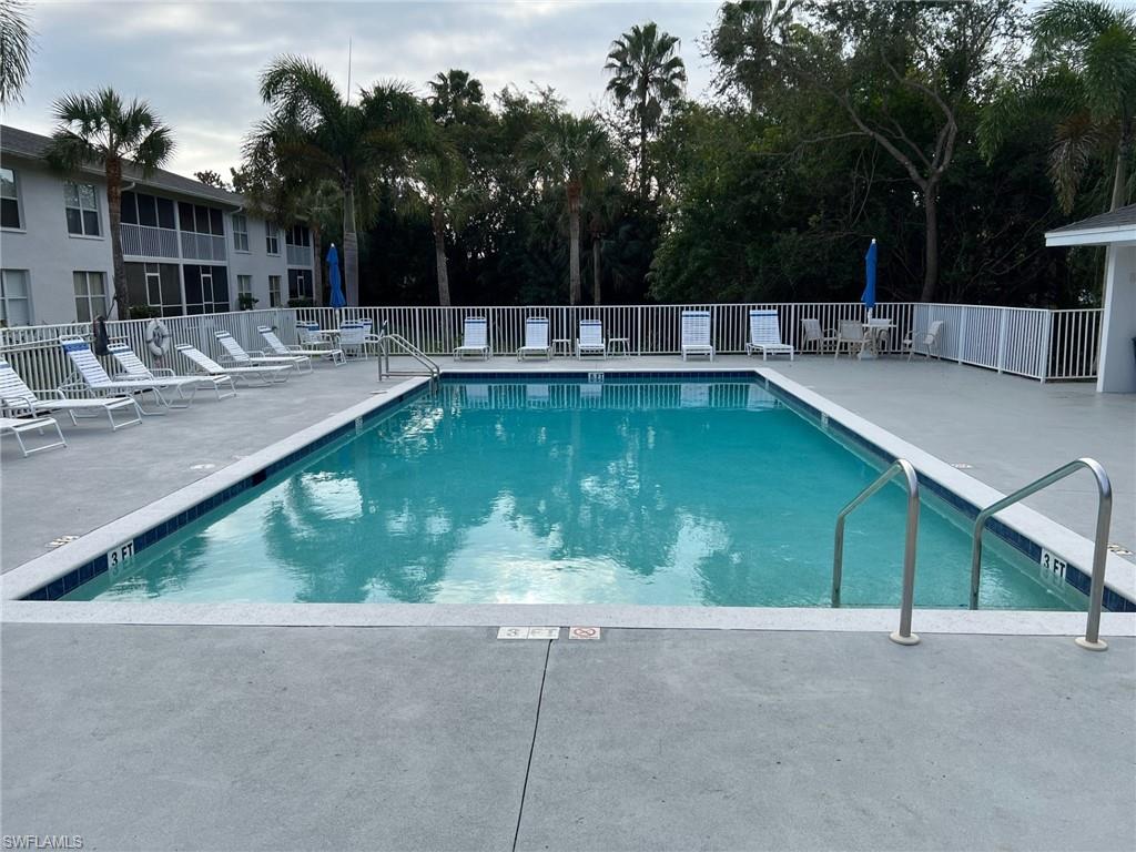 Community pool featuring a patio