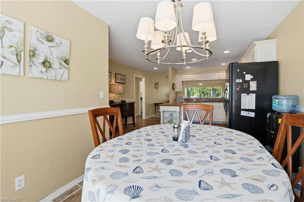 Dining area featuring a chandelier and recessed lighting