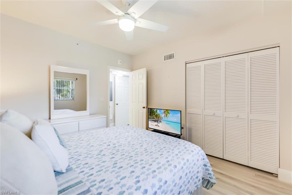 Bedroom featuring light wood-type flooring, a closet, and ceiling fan