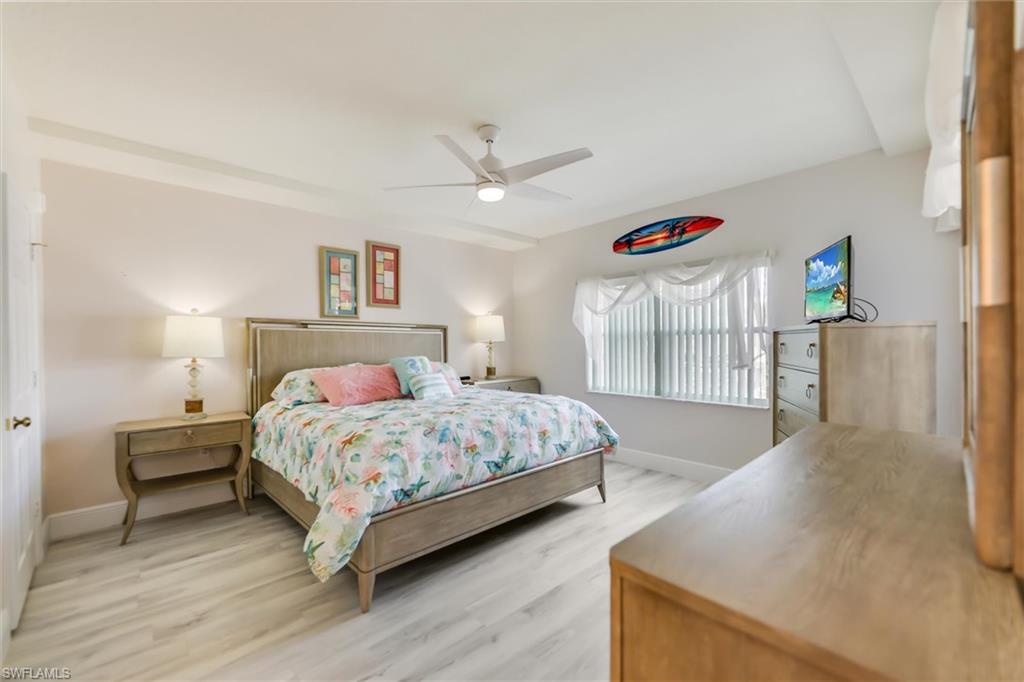 Bedroom with light wood-style floors and ceiling fan