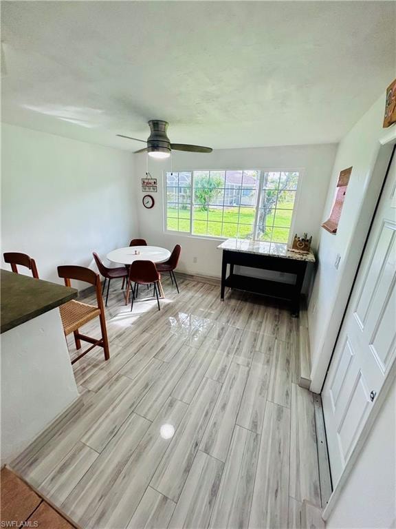 Dining area featuring wood finish floors and baseboards