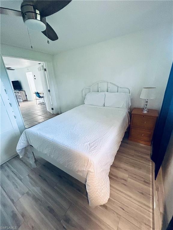 Bedroom featuring wood finished floors and a ceiling fan