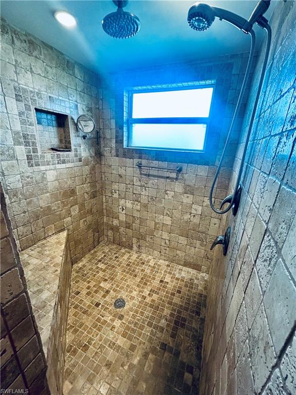 Bathroom with tiled shower